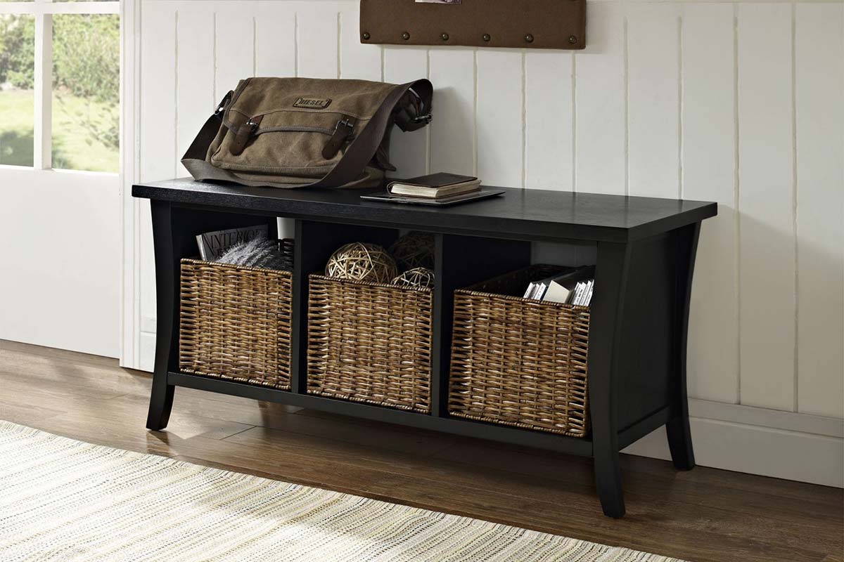 A black wooden side bench with three wicker baskets underneath for storage from Crosley Furniture